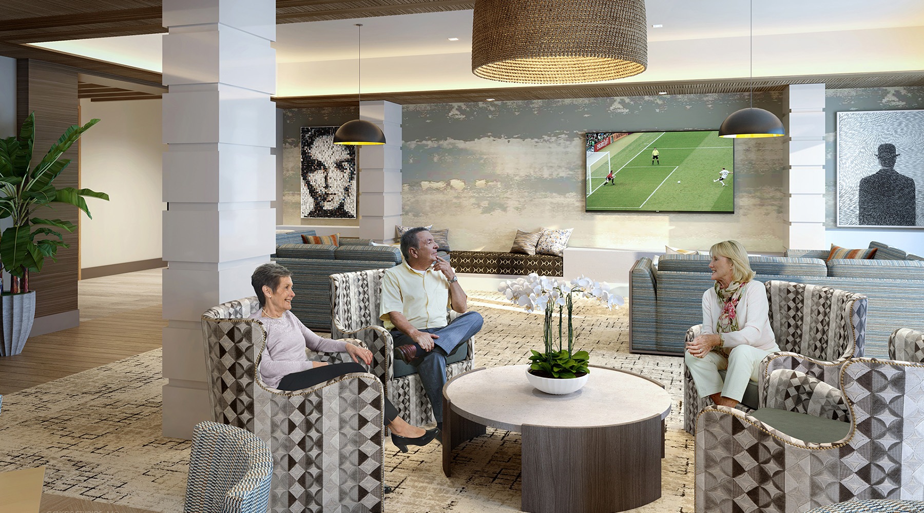 people sitting around a table with a tv in the background